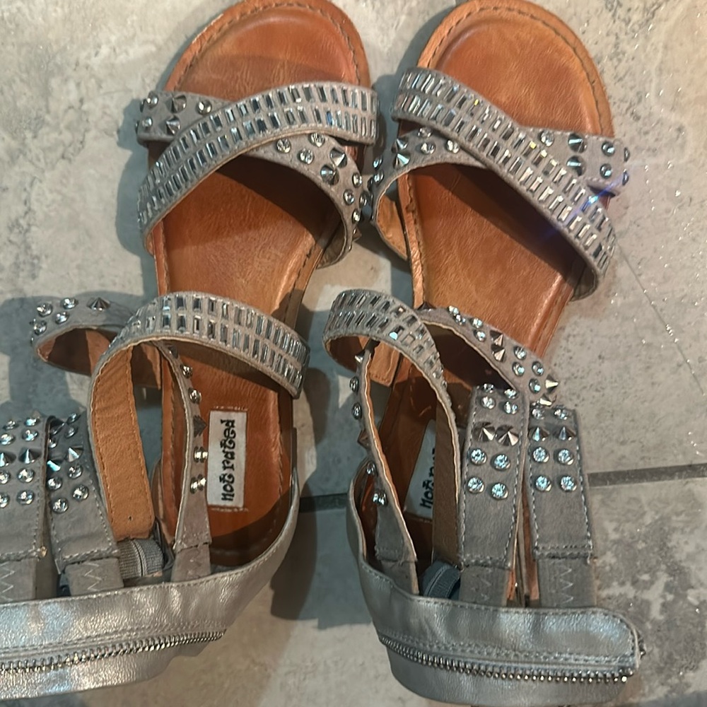 Sandals size 6.  Tanish color. Zips in back.  Some wear on them